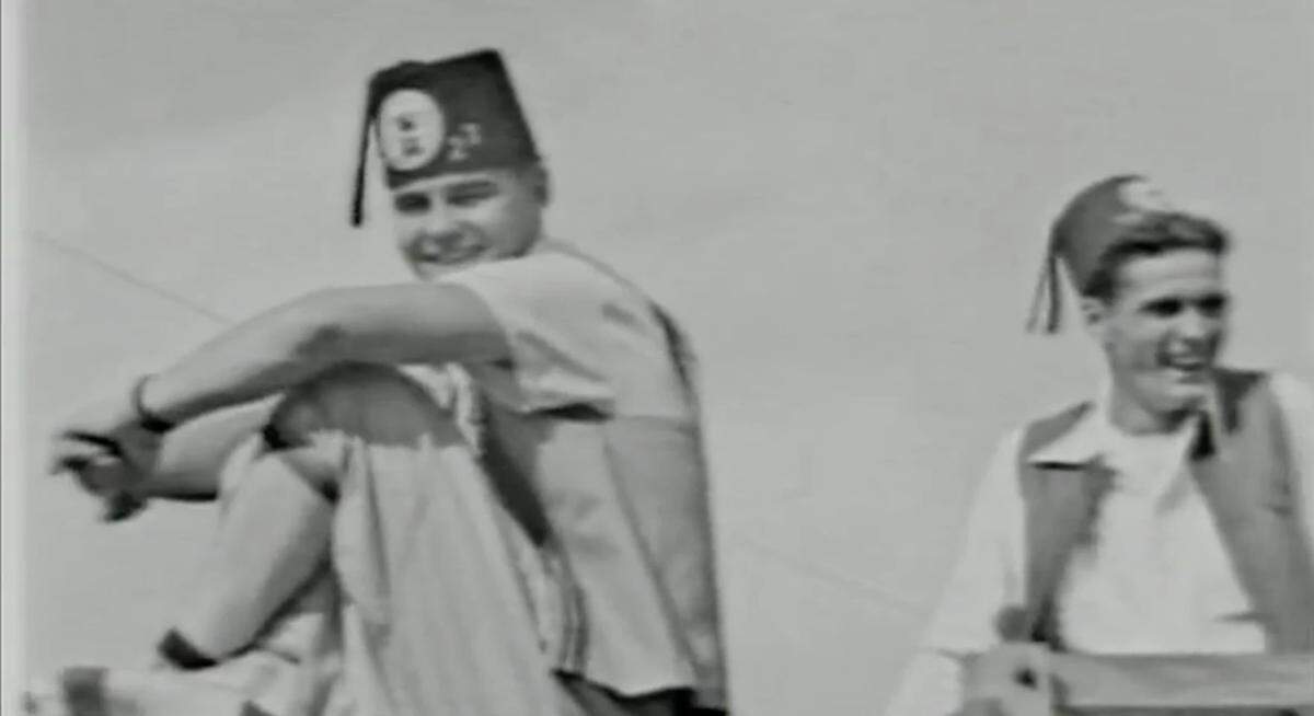 Two men participate in the Opa-locka Arabian Nights parade in 1955.